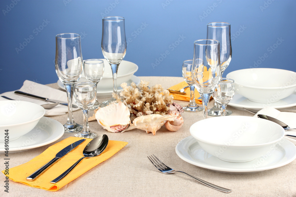 Table setting in white and yellow tones on color  background