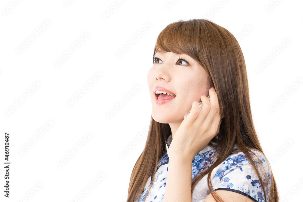 Beautiful asian woman using a cellular phone Beautiful asian woman using a cellular phone