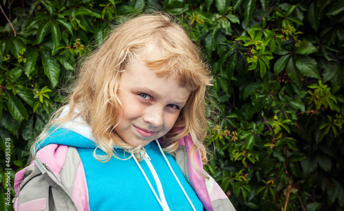 Little blond girl wears casual sport clothes photo