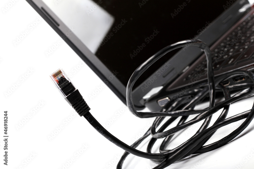 internet cable and laptop on white internet cable and laptop on white