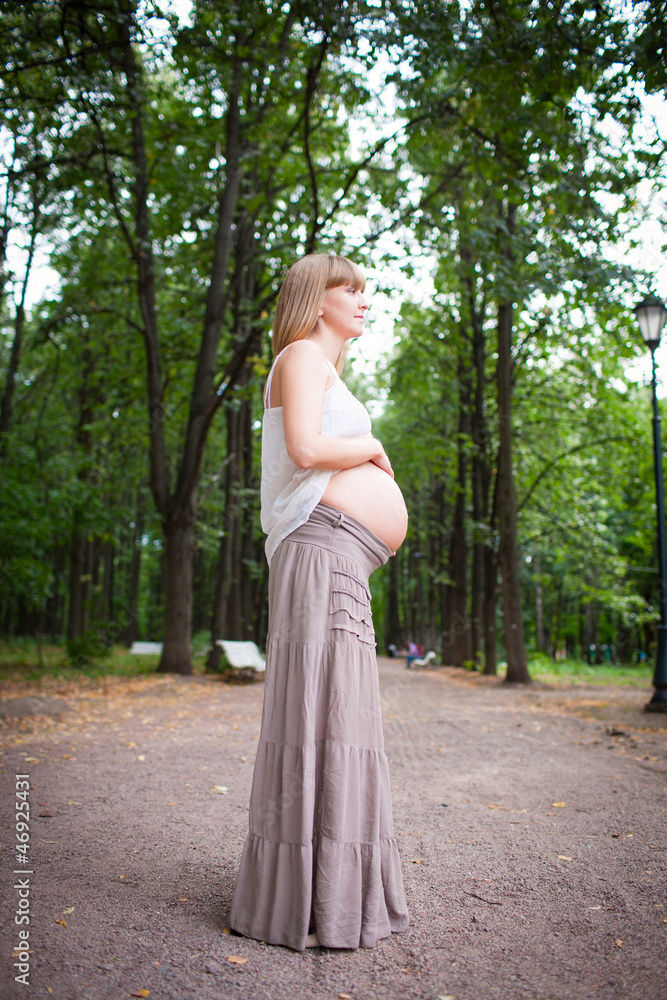 Young happy pregnant woman relaxing and enjoying life in nature Young happy pregnant woman relaxing and enjoying life in nature