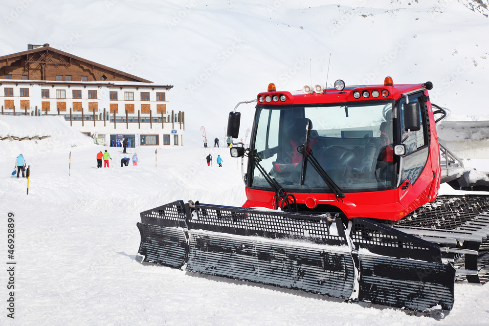 Red machine for skiing slope preparations in Austrian Alps Red machine for skiing slope preparations in Austrian Alps