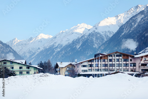 Several luxury hotels in mountains in winter.