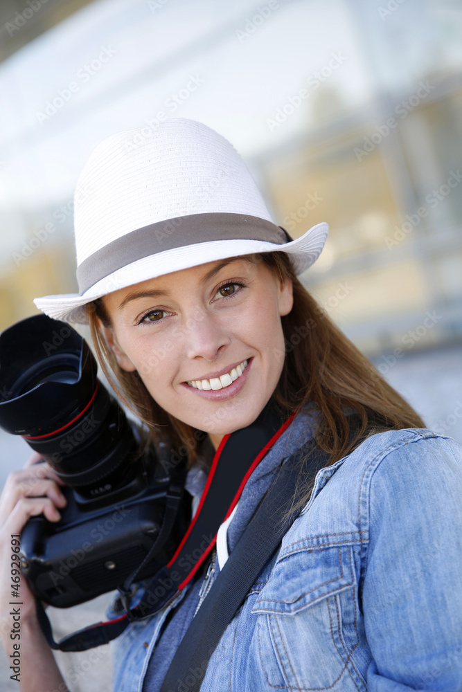Beautiful woman photographer holding photo camera Beautiful woman photographer holding photo camera