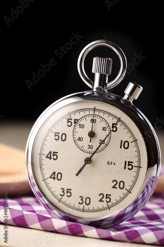 Stopwatch closeup with wooden spoon