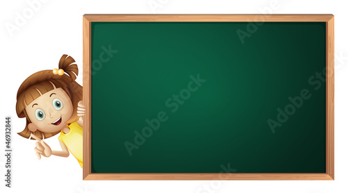 a girl and a green board