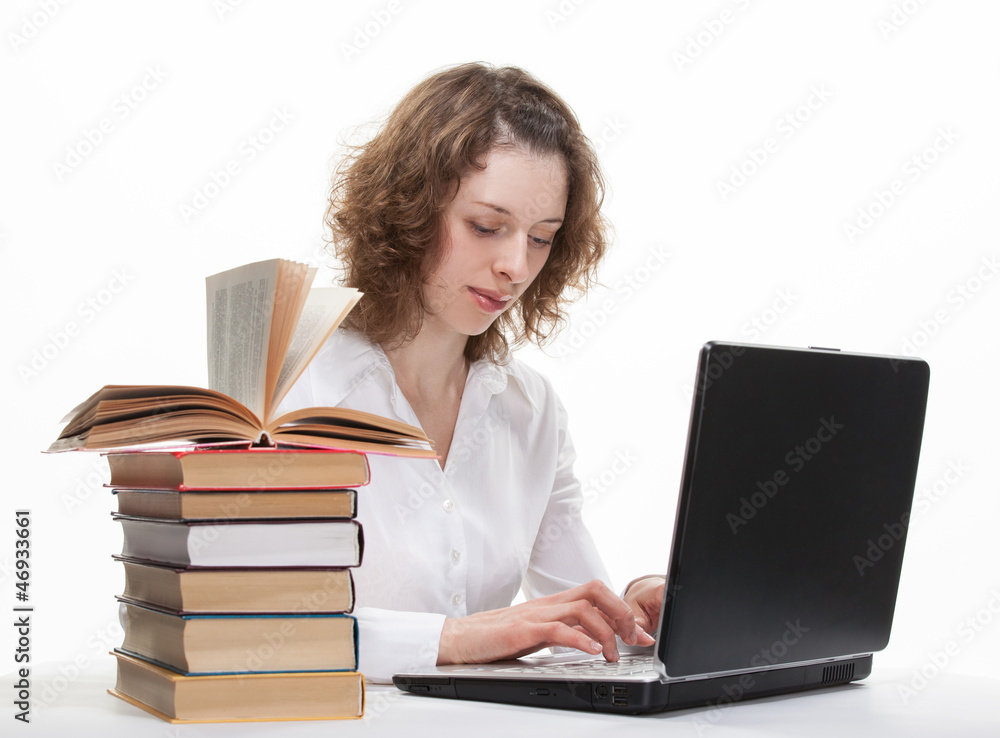 Beautiful smiling young student studying with a notebook Beautiful smiling young student studying with a notebook