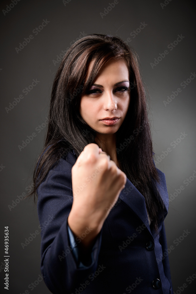Businesswoman showing her fist Businesswoman showing her fist