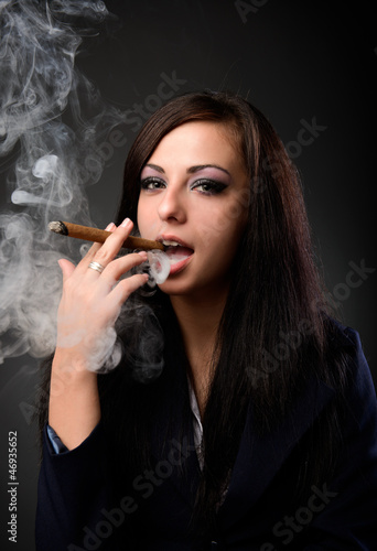 Sexy businesswoman with cigar