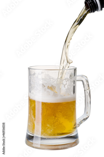Beer being poured into a mug from a bottle