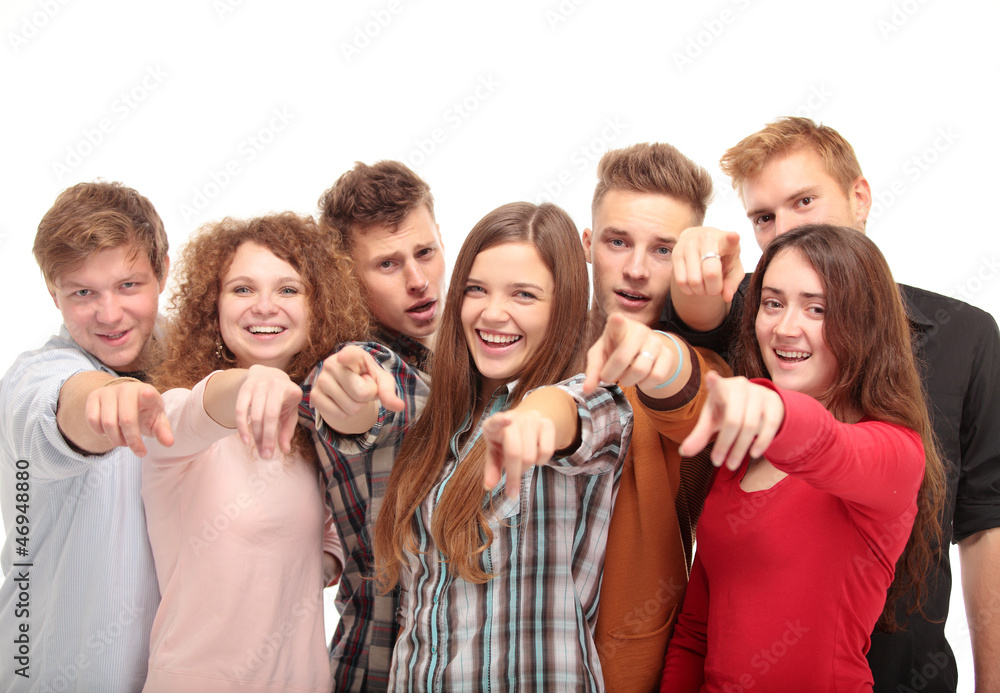 Happy diverse group of executives all pointing at you