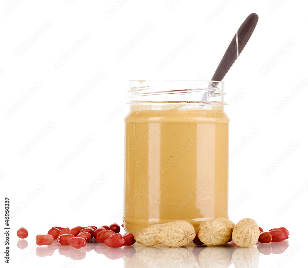 Delicious peanut butter in jar isolated on white Delicious peanut butter in jar isolated on white