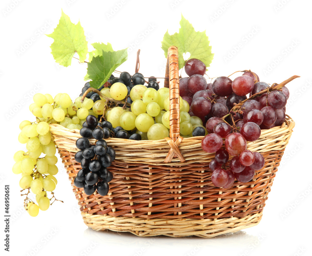 assortment of ripe sweet grapes in basket, isolated on white. assortment of ripe sweet grapes in basket, isolated on white.