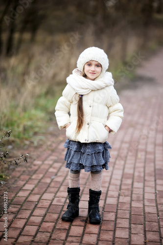 Portrait of little girl in autumn outfit