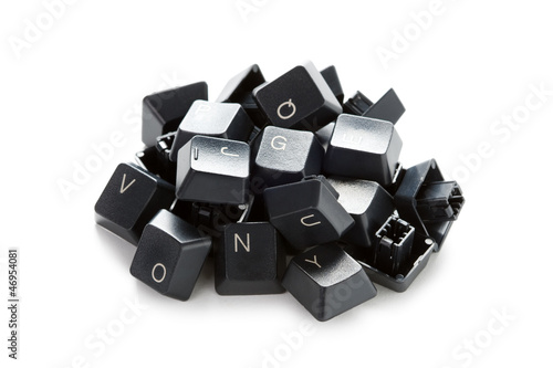 a pile of computer keyboard keys isolated on a white background