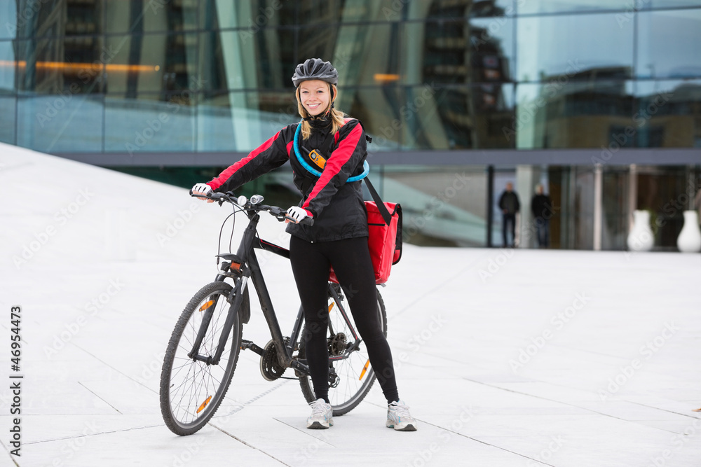 Female Cyclist With Courier Delivery Bag
