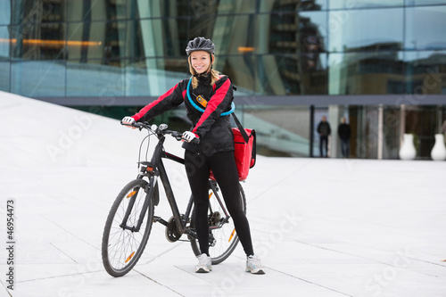 Female Cyclist With Courier Delivery Bag