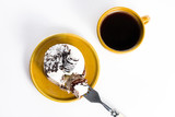 Tasty dessert on the round plate with cup of coffee
