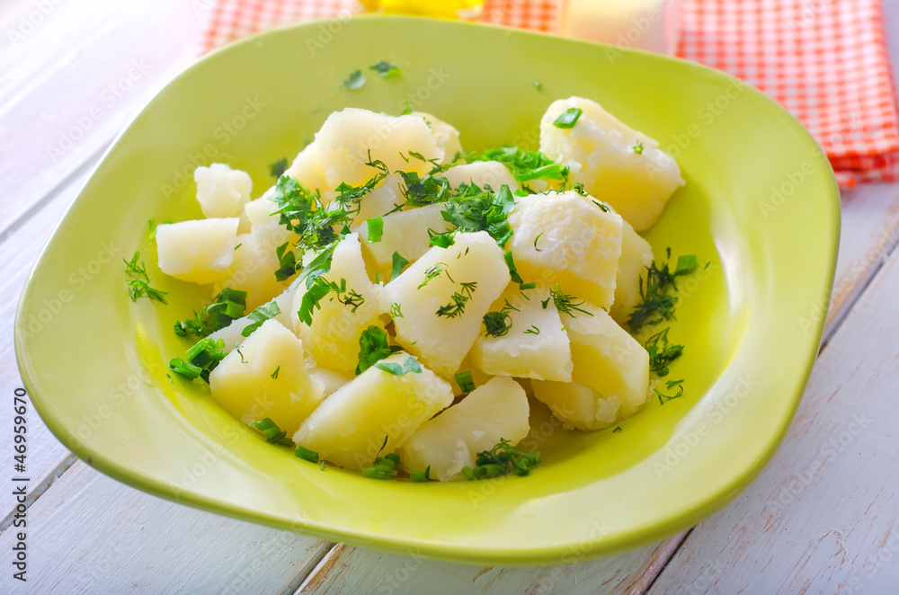 boiled potato with greens in the green plate boiled potato with greens in the green plate