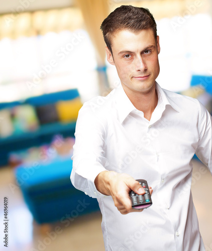 Man Holding Remote In His Hand