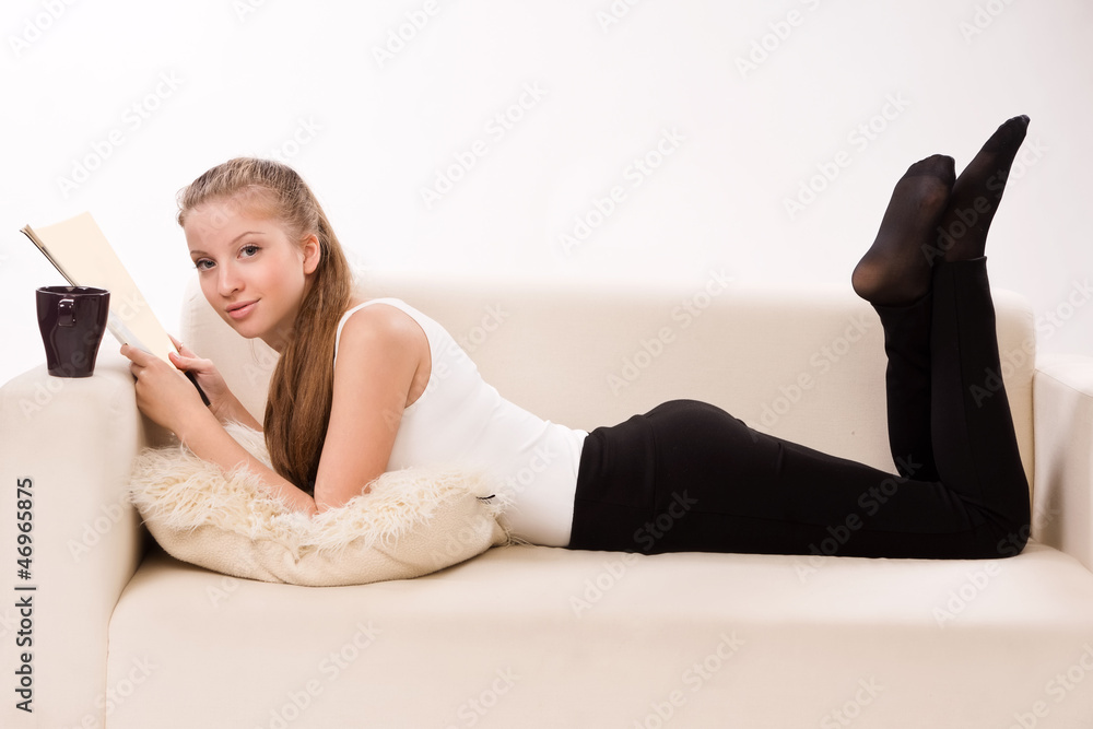 Attractive woman lying on a sofa