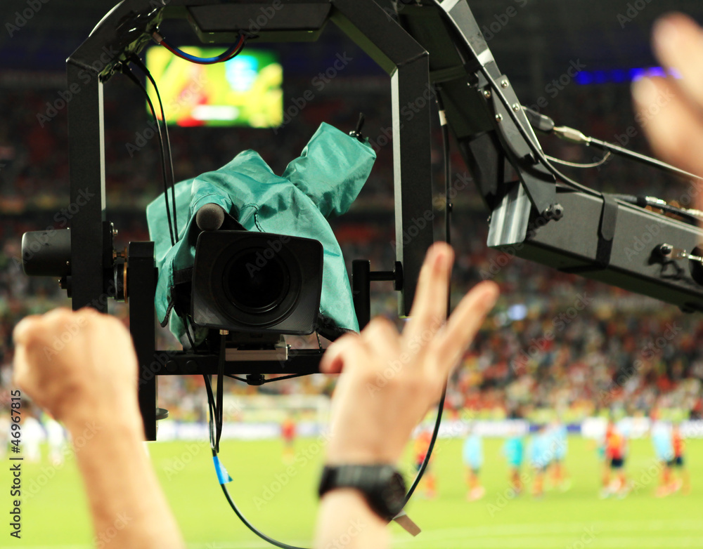 Obraz premium TV Camera shoots fans sector during match