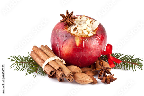 baked apple with fir branch isolated on white