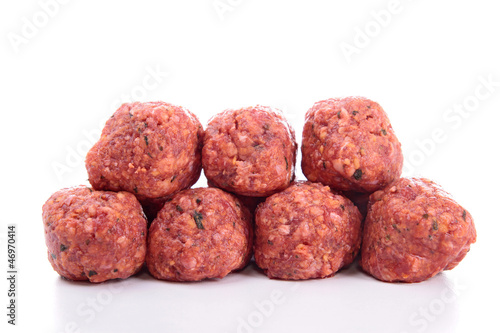 raw meatballs on white background
