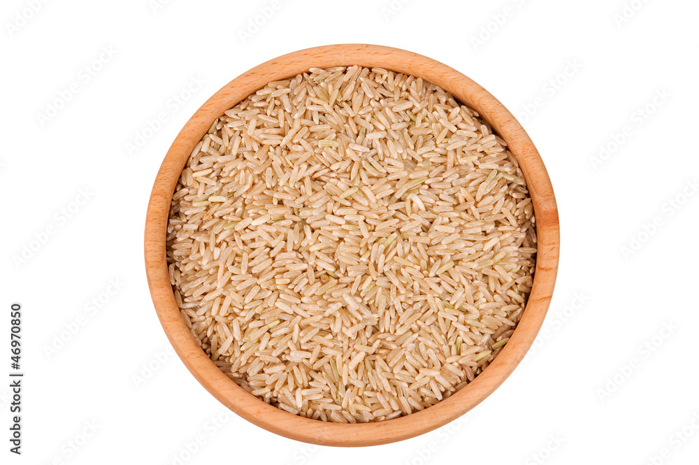 Raw brown rice in wooden bowl isolated on white (clipping path) Raw brown rice in wooden bowl isolated on white (clipping path)