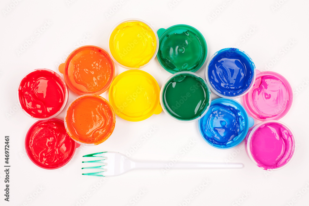 motley paints on the white background. paints arranged as rainbo motley paints on the white background. paints arranged as rainbo