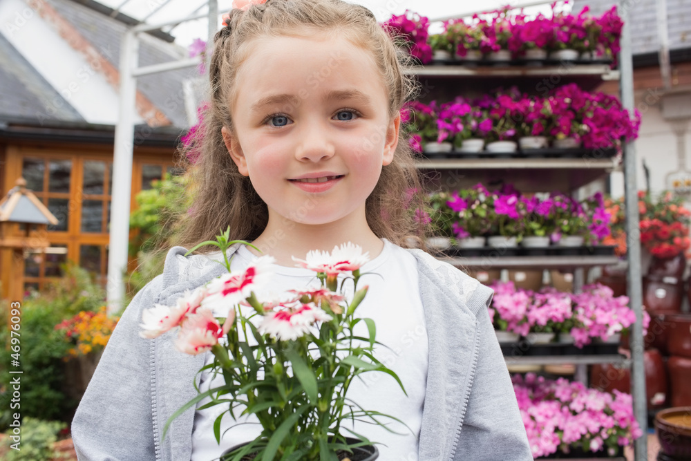 Child holding potted plant Child holding potted plant