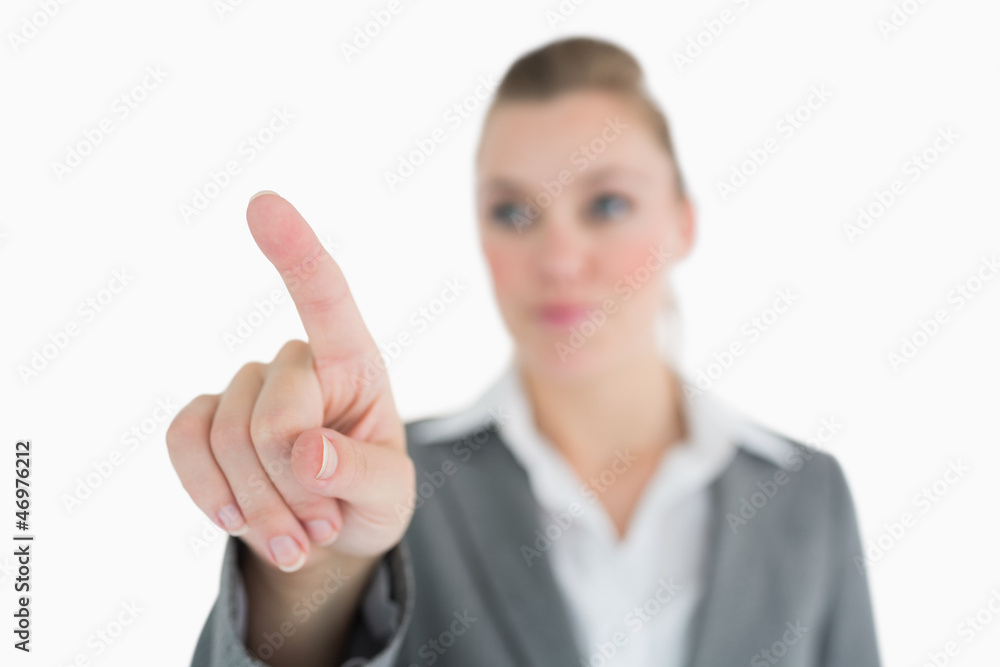 Happy woman pointing in the air