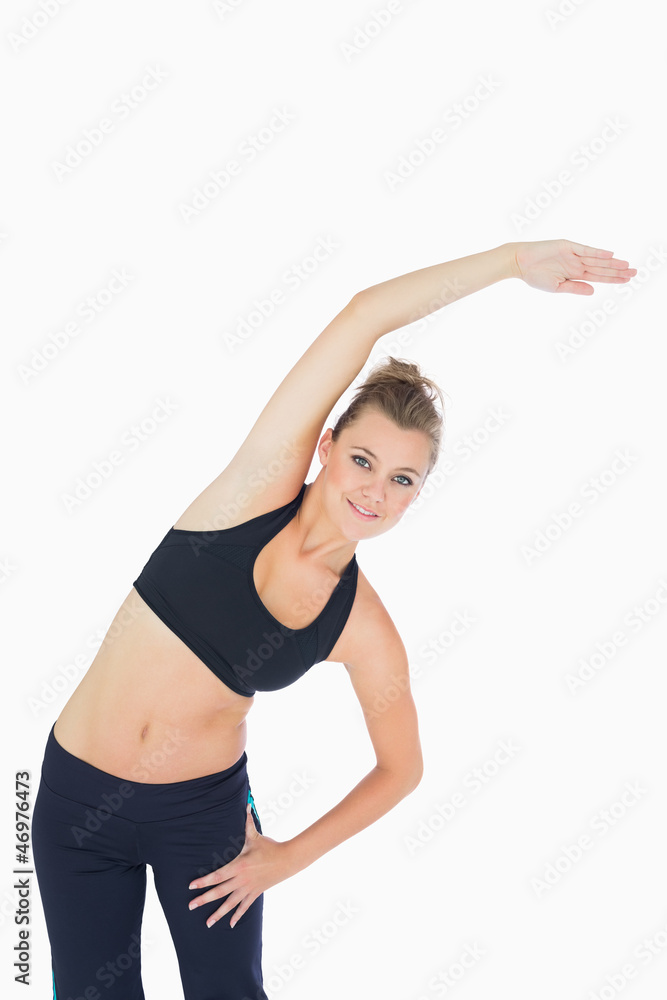 Woman leaning to the right and stretching Woman leaning to the right and stretching