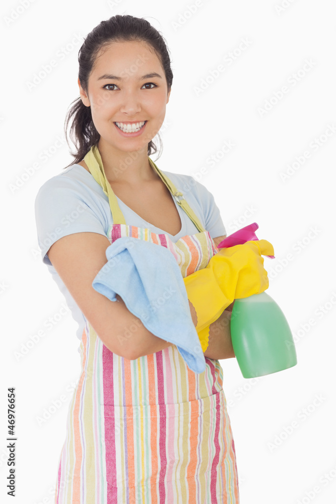 Happy woman holding cleaning products Happy woman holding cleaning products