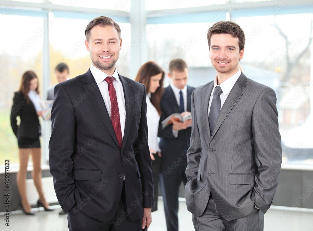 Two business men working together in the office Two business men working together in the office