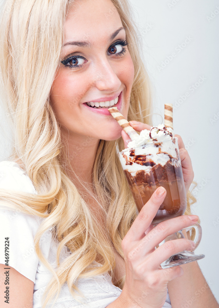 Young woman drinking ice coffe, studio-shot Young woman drinking ice coffe, studio-shot