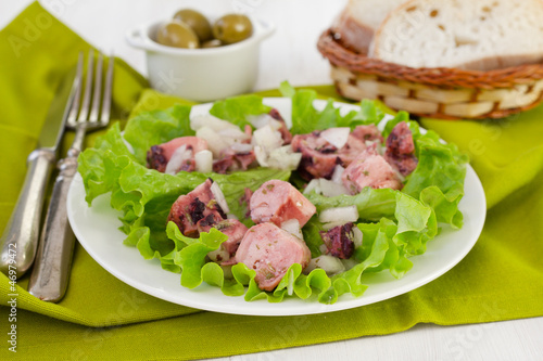 salad with octopus and onion and bread