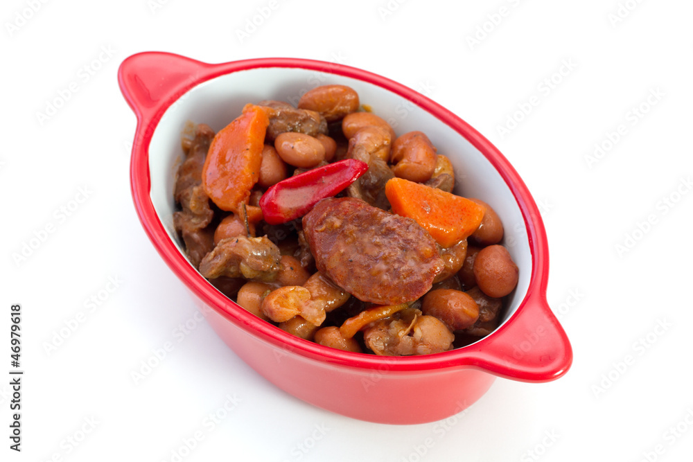 meat with sausages and beans in the bowl on white background meat with sausages and beans in the bowl on white background