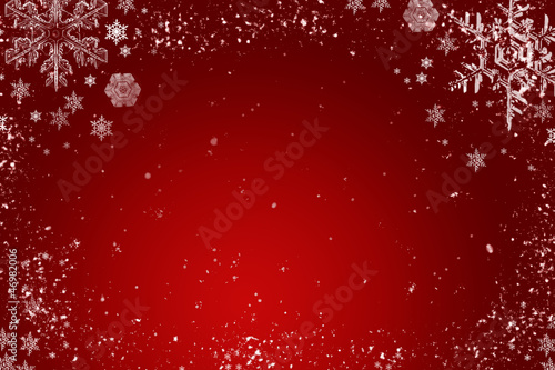 Red christmas background with white snowflakes photo