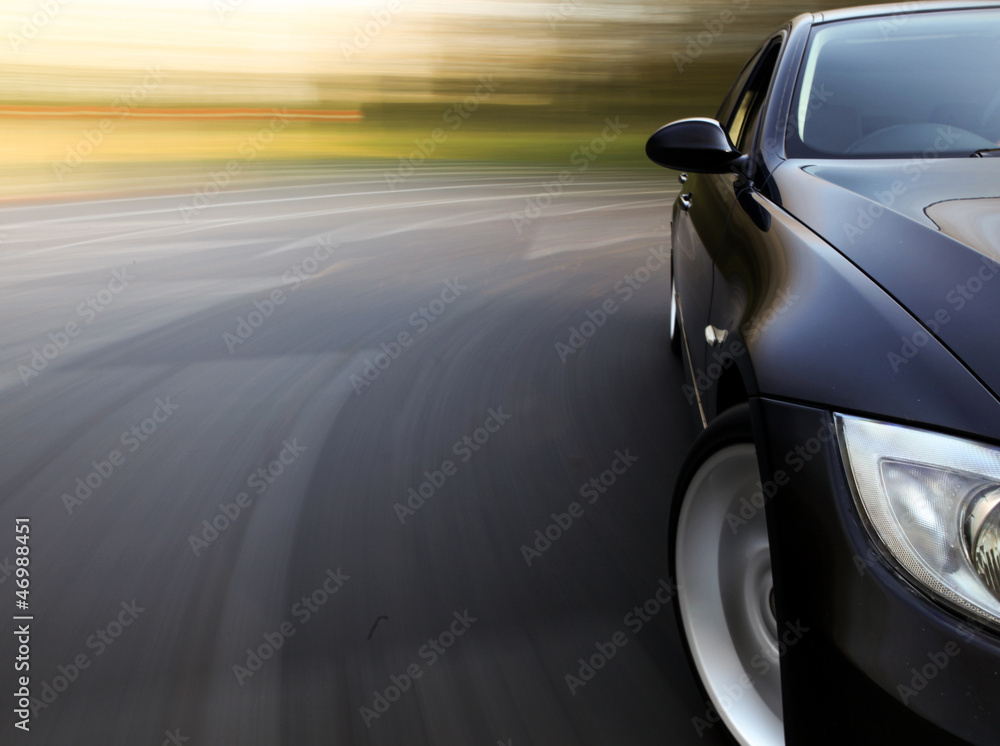 Amazing side front view of black car with blurred motion