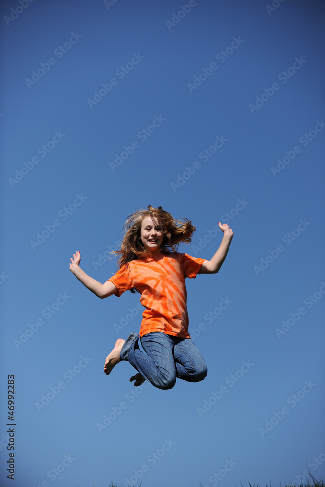 Young Girl Jumpingon a sunny day Young Girl Jumpingon a sunny day