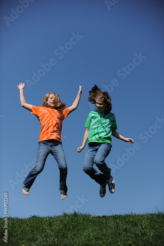 Two young Girls jumping