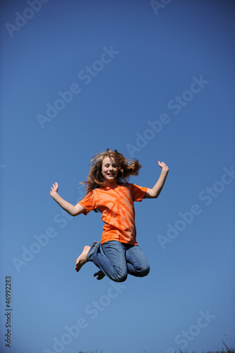 Young Girl Jumpingon a sunny day