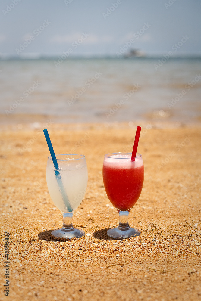 Pair of fruit shakes on the tropical beach 