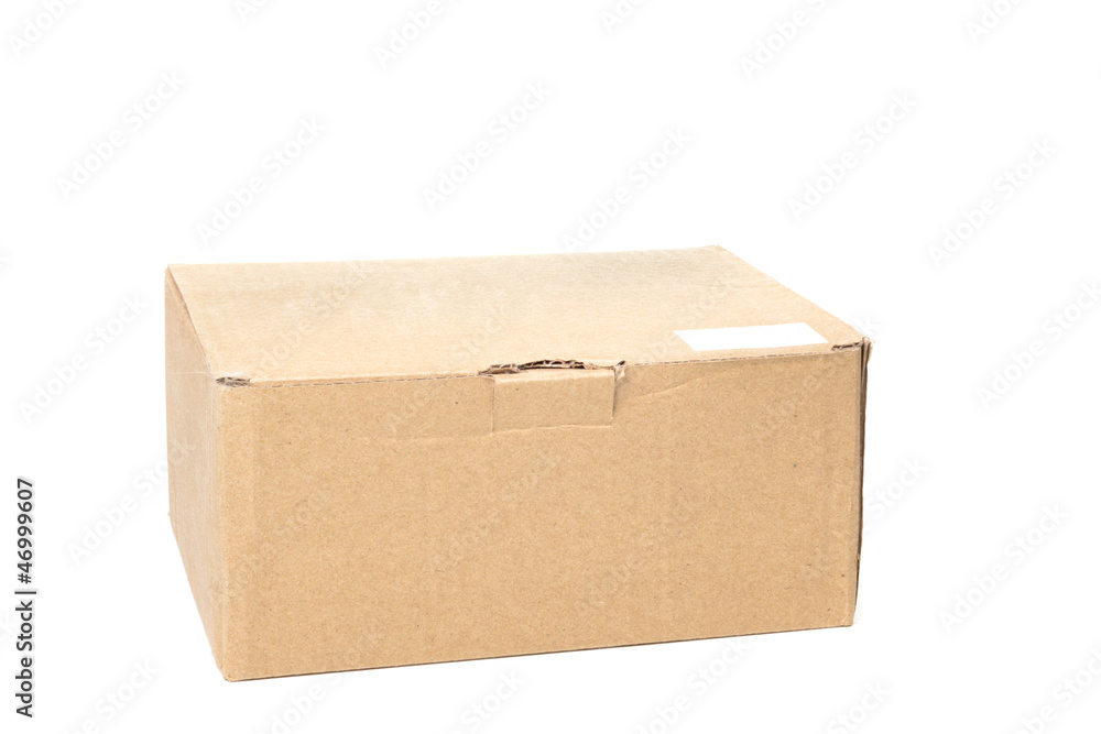 Cardboard box who are closed with a white label Cardboard box who are closed with a white label