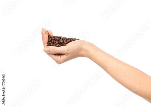 Fresh roasted coffee beans in hand