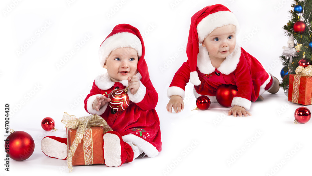 two funny small kids in Santa Claus two funny small kids in Santa Claus