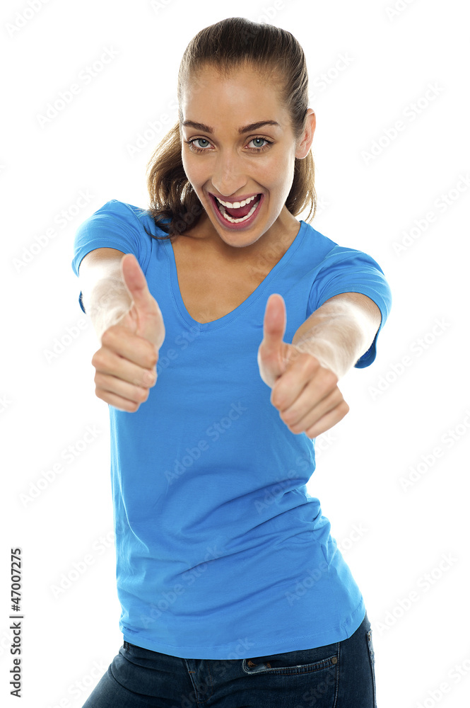 Overjoyed woman showing double thumbs up Overjoyed woman showing double thumbs up