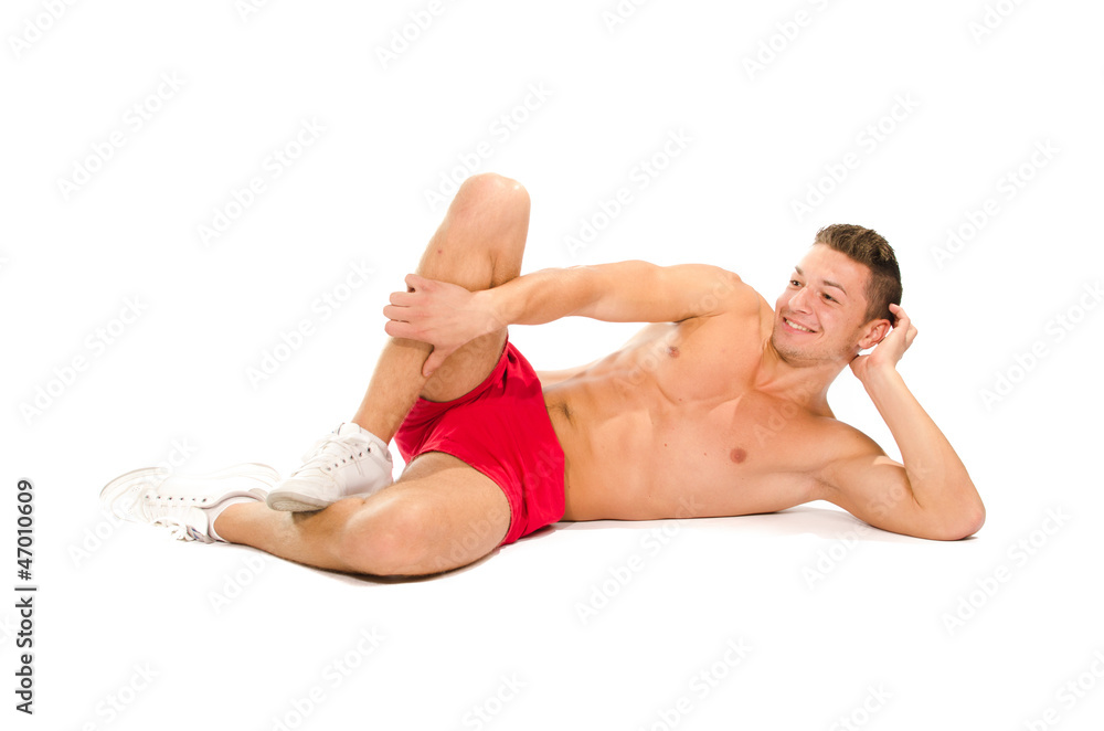 Portrait of muscular man lying on the floor Portrait of muscular man lying on the floor