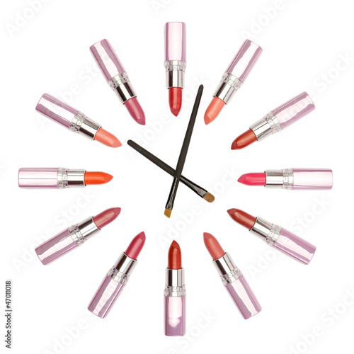 Various color lipstick and make-up brushes looks like watches
